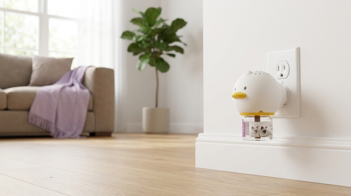 PurrEase diffuser plugged in at realistic scale in a modern living room